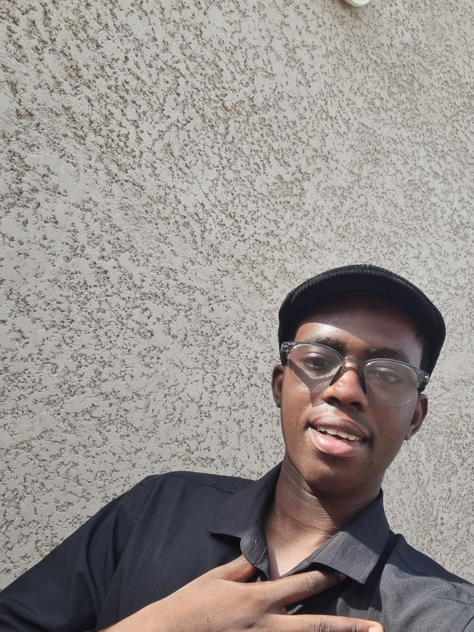 Fawaz Olayinka, FHG Business Builder and NeoLife Emerald Director, wearing a black cap and glasses